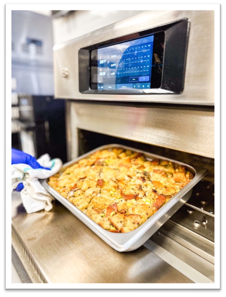 Baked dish coming out of an oven
